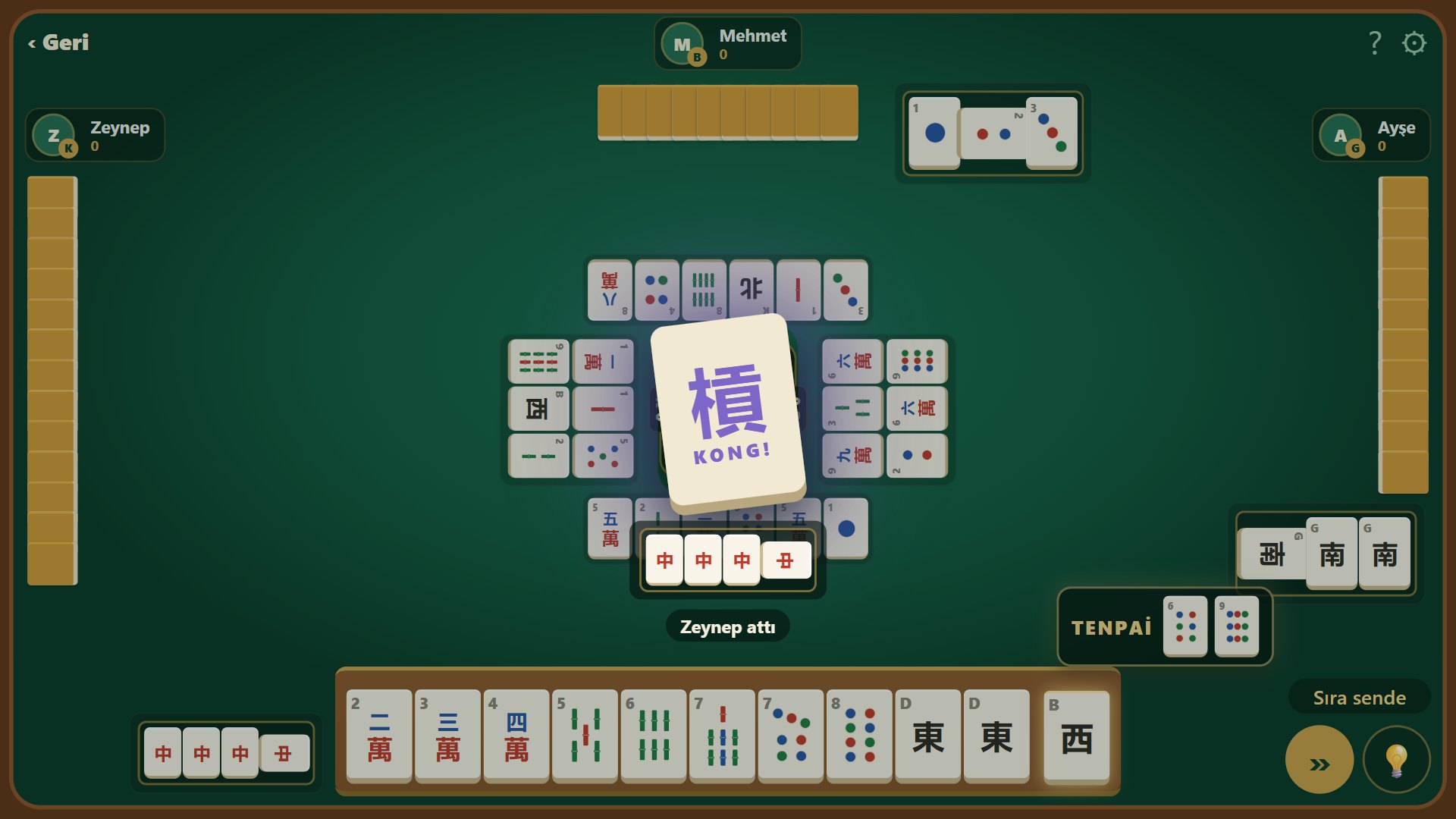 Claiming a kong: the callout in the middle of the table with all four tiles
